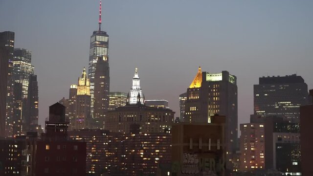 Night NYC, cityscape view of Manhattan skyscraper buildings in New York City.  financial, economic and business center of America.