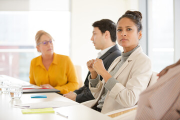 Portrait of smiling businesswoman in conference room meeting