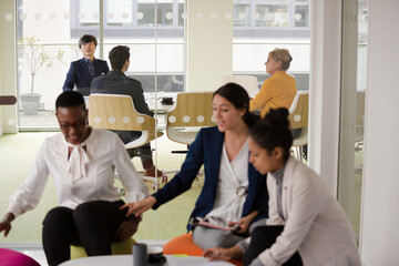 Enthusiastic business people working together in relax zone