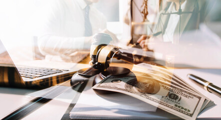 Business and lawyers discussing contract papers with brass scale on desk in office. Law, legal services, advice, justice and law concept picture with film grain effect