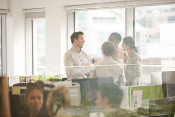 Fototapeta premium Business people talking in open plan office
