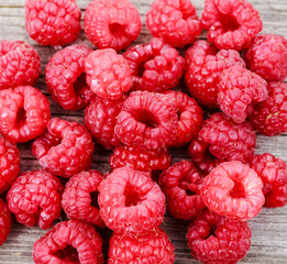 Ripe raspberries on wooden background. Texture, Fresh red berries close up, macro of ripe...