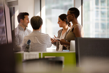 Fototapeta premium Business people talking in open plan office