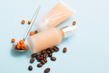Natural cosmetic products on a blue background. Cosmetic bottle mockup.