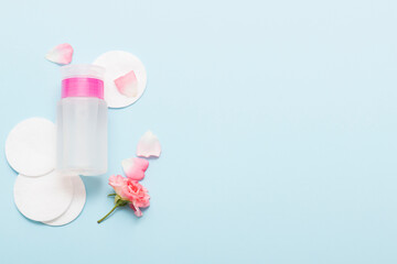 Natural cosmetic products on a blue background. Cosmetic bottle mockup.