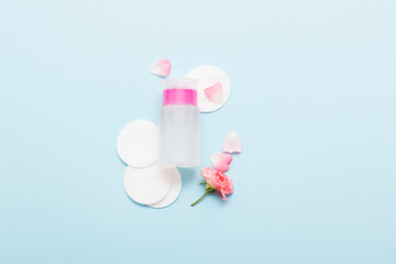 Natural cosmetic products on a blue background. Cosmetic bottle mockup.