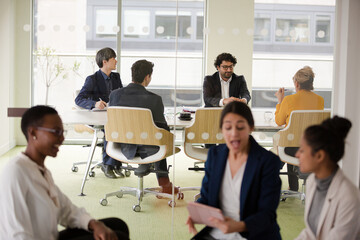 Enthusiastic business people working together in relax zone