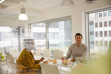 Business people enjoying sushi lunch