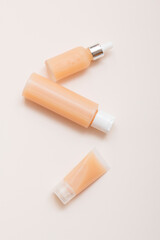 Natural cosmetic products on a light background. Mockup of cosmetic jars, bottles, tubes.