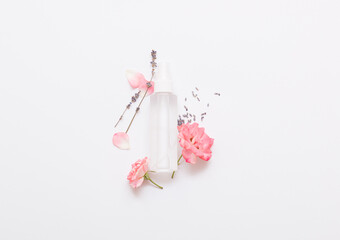 Natural cosmetic products on a white background. Transparent cosmetic bottle mockup.