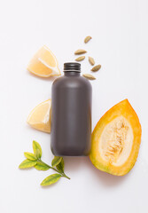 Natural cosmetic products on a light background. Black cosmetic bottle mockup.