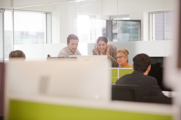 Business people brainstorming in open plan office