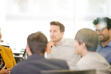 Fototapeta premium Business people brainstorming in open plan office