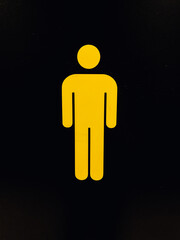 Entrance to the men's toilet, yellow male silhouette on a black background, illustration, bathroom
