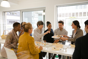 Business people enjoying sushi lunch