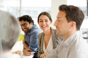 Fototapeta premium Business people enjoying sushi lunch in conference room