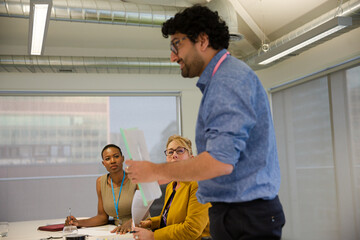 Businessman leading conference room meeting