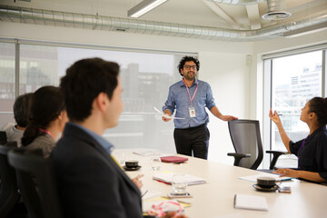 Businessman leading conference room meeting