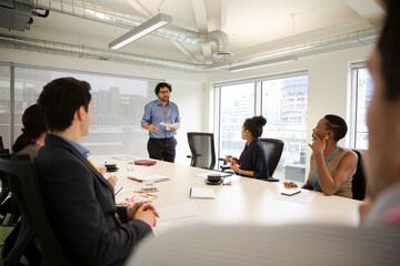 Businessman leading conference room meeting