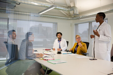Fototapeta premium Businesswoman leading conference room meeting