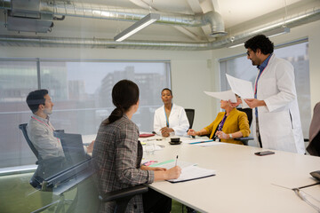 Businessman leading conference room meeting