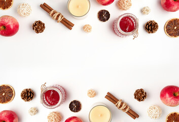 Autumn flat lay composition of apples, fall foods and decor on white background. Ingredients for jam or mulled wine. Autumn or winter holiday food concept. Creative trendy flat lay with place for text