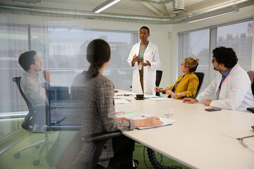 Businesswoman leading conference room meeting