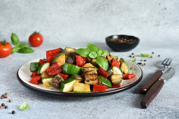 The classic dish of baked vegetables is ratataui..Baked vegetable salad with sow and basil.