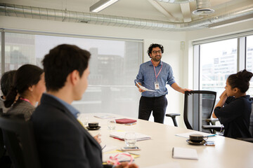 Businessman leading conference room meeting