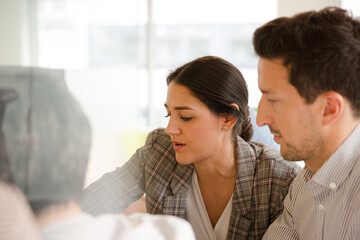 Business people enjoying sushi lunch in conference room