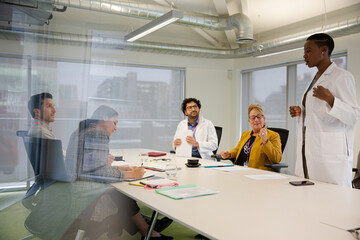 Businesswoman leading conference room meeting