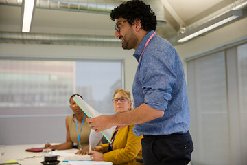 Businessman leading conference room meeting