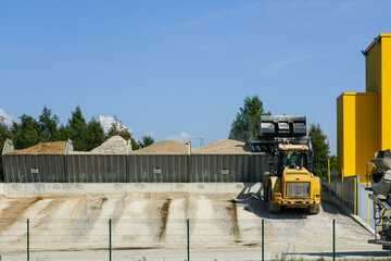 fractions of materials of different sizes in tanks at a concrete mixing plant