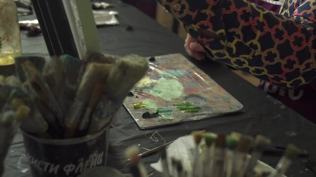 Artist draws a picture in an art studio
