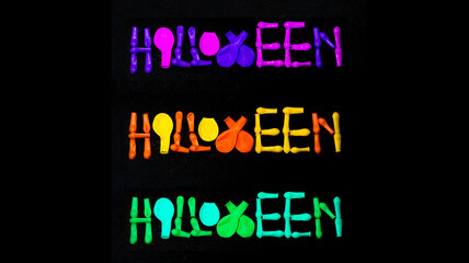 Poster with the word halloween made with coloful balloons on black background 