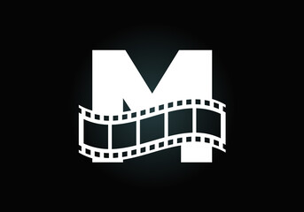 Initial M monogram alphabet incorporated with film reel. Video and movie logo concept. Font emblem. Logo for the entertainment business and company identity