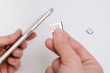 Removing a sim card out of a smartphone, replacing simcard and changing number