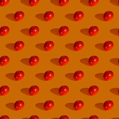 Seamless pattern made from tomato on orange background, Flat lay photo