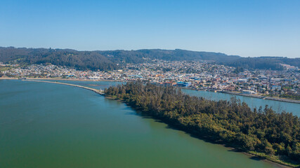 Rio Maule, constitucion, chile, horizontal aerial view with drone of the river and city 
