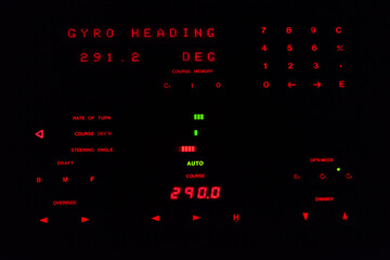 Marine Global Maritime Distress and Safety System radio communication console by night.