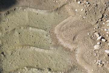 tractor print in the sand