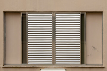 window in a building facade made of aluminum and closed