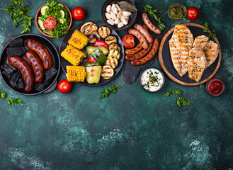 Grilled sausages, meat, and vegetables.