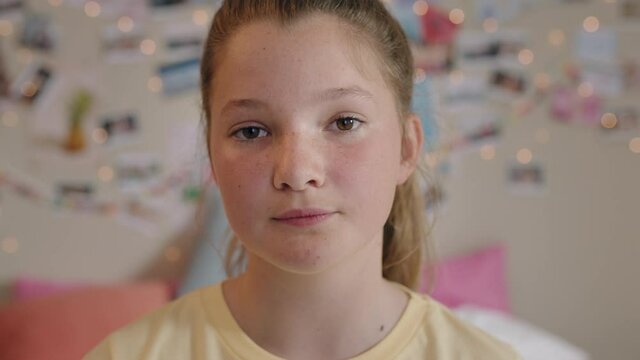portrait beautiful teenage girl looking confident teenager at home in bedroom teen self image concept 4k footage