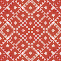ethnic pattern with geometric seamless flower in red background for fabric