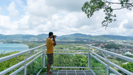 Travel man Photography take a picture Landscape nature view at Phuket Thailand beautiful view point landscape