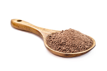 granulated chocolate powder in rustic wooden spoon with copy space on isolated white background.