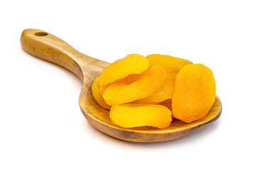 dried and dried apricot made in brazil in rustic wooden spoon, isolated white background.