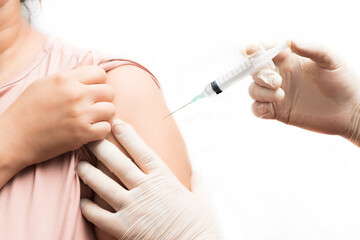 Vaccination, immunization, disease prevention concept. Nurse or medical professional administering antiviral injection to patient in arm