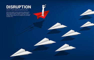 Silhouette of businessman looking through telescope standing on red origami paper airplane go different way from group of white. Business Concept of disruption and vision mission. © Panithan